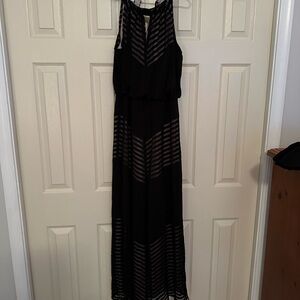 Elegant black sheer over nude silk liner gown.